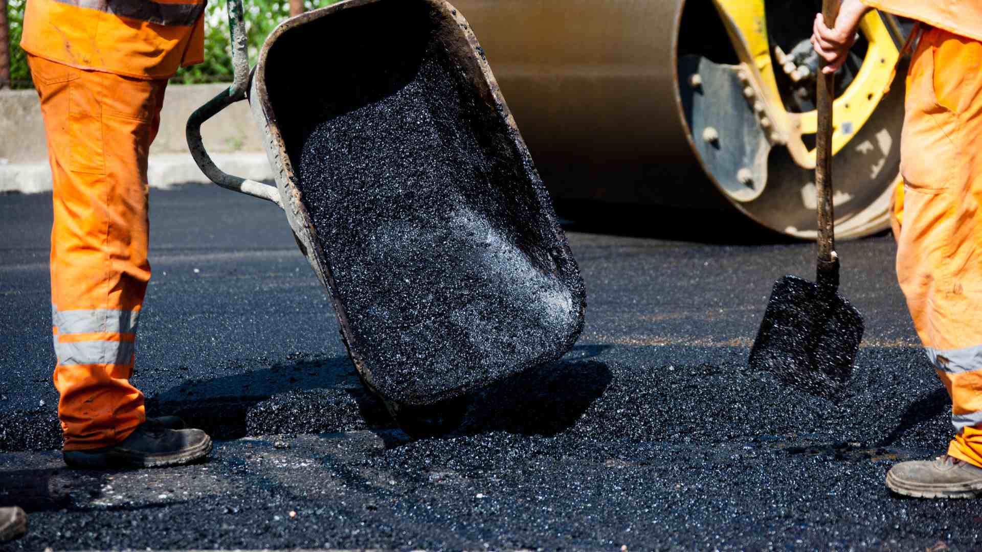 asphalting servinces close up orange suits